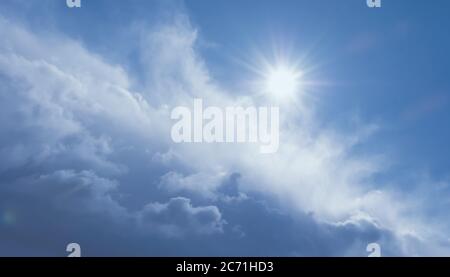 beautiful stormy clouds, blue sky and sunshine after rain Stock Photo
