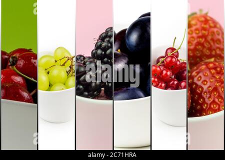 collection of fruit in white ceramic bowls on multicolor background isolated, cherry, grape, plum, strawberry, blackberry, currant Stock Photo