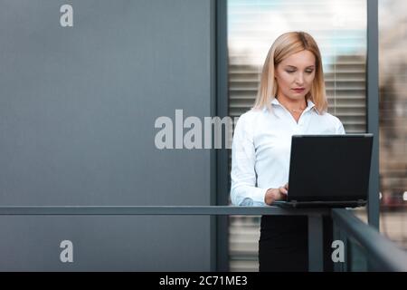 Business lady working on a laptop Stock Photo