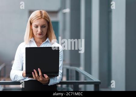 Business lady working on a laptop Stock Photo