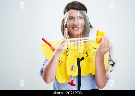 Stewardess wearing protective mask isolated over white background Stock Photo