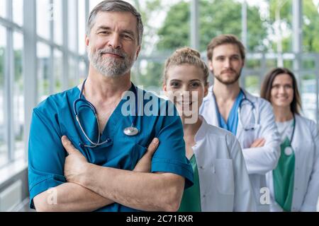 Doctor leading a medical team at the hospital. Stock Photo
