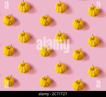 Seamless pattern with pumpkins on a pink background Stock Photo