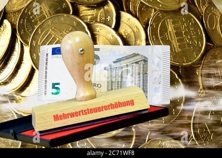 Stamp with inscription VAT increase and banknote, coins in the background Stock Photo