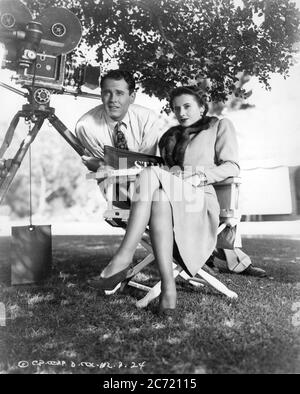 HENRY FONDA and BARBARA STANWYCK on set candid with Movie Camera during filming of YOU BELONG TO ME 1941 director WESLEY RUGGLES story Dalton Trumbo screenplay Claude Binyon Columbia Pictures Stock Photo