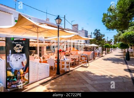 , , , Poorly frequented restaurants and closed shops in the formerly well frequented holiday resort Cala d'Or on the south-east coast of Mallorca. The Stock Photo