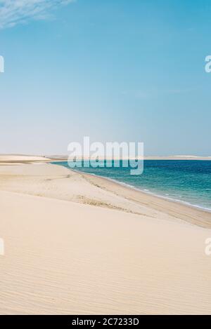 The desert in the south of Qatar runs into the Khor Al Adaid (Khawr al Udayd) or Inland Sea, part of the Persian Gulf (Arabian Gulf) Stock Photo