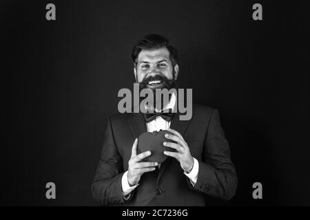 All you need is love. Romantic greeting. happy valentines day. tuxedo man red heart. love date. mature hipster beard in formal suit. problems with heart. businessman with bow tie. problems with heart. Stock Photo