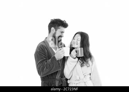 happy couple having breakfast in bathrobe. wake up with fresh coffee cup. time to relax. feeling cozy and refreshed. woman and man enjoying weekend. lazy sunday. fresh coffee in the morning. Stock Photo