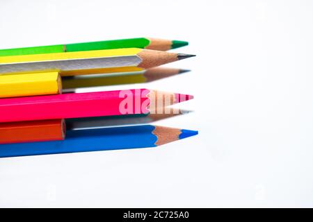 Many different colored wood pencil crayons placed together in a circle pattern Stock Photo