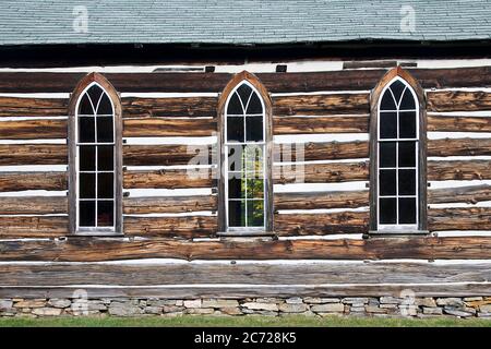 Madill, Ontario / Canada - 10/05/2016: Side view of the detail of the weathered wooden log cabin church. Stock Photo