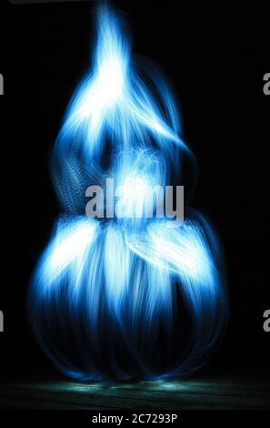 Abstract light curves in the shape of a flower bulb Shapes drawn to optical fiber at lightpainting. Stock Photo