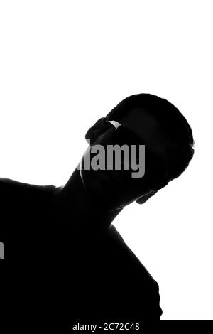 Portrait of a young man in front view diagonally - silhouette Stock Photo