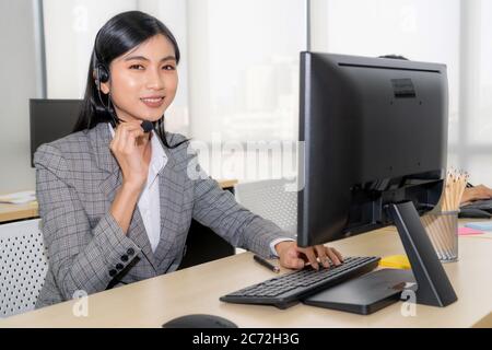 Business People Wearing Headset Working In Office To Support Remote 