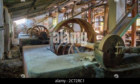 Rusty equipment in an abandoned old marble quarry factory in Marmara island, Balikesir, Turkey Stock Photo