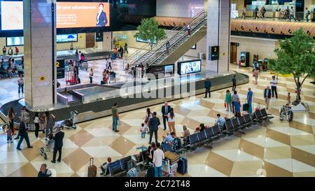 Baku, Azerbaijan - July 2019: Arrived passengers collecting their luggage in Heydar Aliyev airport Stock Photo