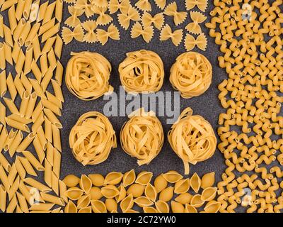 Different types of Italian pasta. Top view. Pasta background. Stock Photo