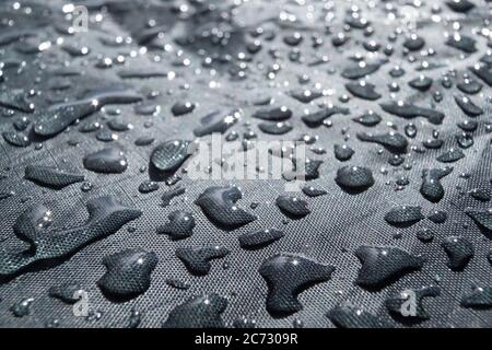 Rain water droplets on waterproof fabric for clothes Stock Photo