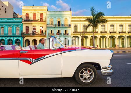 Classic convertible  car and colorful buildings in downtown Havana Stock Photo