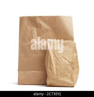 full paper disposable bag of brown kraft paper isolated on white background, concept of rejection of plastic packaging, template for designer, packagi Stock Photo