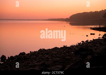 Fiery sunset over the Coquille River in Bandon Oregon Stock Photo
