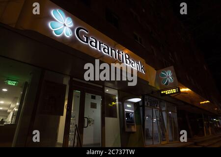 BRASOV, ROMANIA - FEBRUARY 14, 2020:  GarantiBank logo in front of their local office for Brasov. Garanti Bankasi BBVA is a Turkish retail banking gro Stock Photo