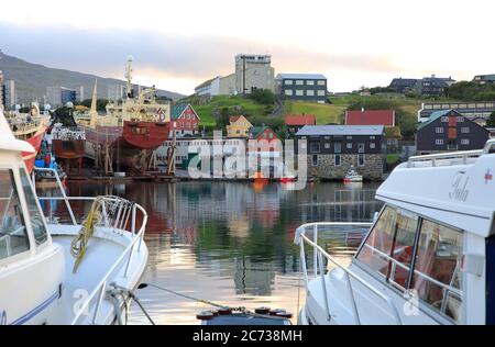 Motorboats docking in Torshavn Harbor.Torshavn.Streymoy.Faroe Islands.Territory of Denmark Stock Photo