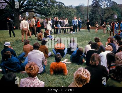 1970s PEACEFUL CAMPUS PROTEST DEMONSTRATION TEACH-IN STUDENTS STANDING SITTING ON LAWN SPEAKING ON AN ISSUE LONG ISLAND NY USA - ks6708 KRU001 HARS YOUNG ADULT PEACE BALANCE SAFETY TEAMWORK COMPETITION INFORMATION PROTEST LIFESTYLE CAMPUS CELEBRATION FEMALES UNITED STATES COPY SPACE FULL-LENGTH LADIES PERSONS INSPIRATION UNITED STATES OF AMERICA CARING MALES RISK TEENAGE GIRL TEENAGE BOY NY SPIRITUALITY SADNESS NORTH AMERICA FREEDOM GOALS NORTH AMERICAN WIDE ANGLE DISCOVERY UNIVERSITIES COURAGE CHOICE KNOWLEDGE LEADERSHIP POWERFUL PROGRESS AN ON AUTHORITY DEMONSTRATION PEACEFUL POLITICS Stock Photo