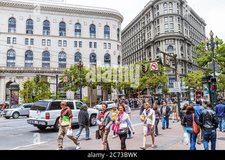 California San Francisco Market Street at Powell,downtown street traffic intersection pedestrian crossing,Hallidie Plaza Flood Flatiron Building build Stock Photo