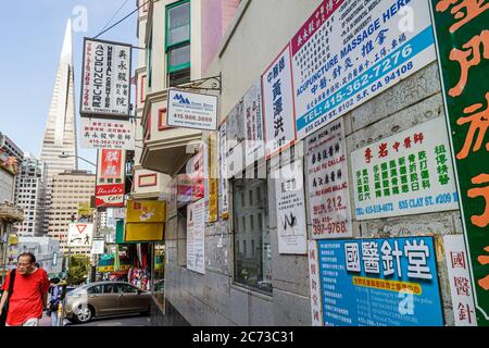 San Francisco California,Chinatown,ethnic neighborhood,Clay Street,kanji,hanzi,street scene,signs,signs,Chinese language,bilingual,bilingual,acupunctu Stock Photo