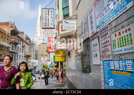 San Francisco California,Chinatown,ethnic neighborhood,Clay Street,kanji,hanzi,street scene,signs,signs,Chinese language,bilingual,bilingual,acupunctu Stock Photo