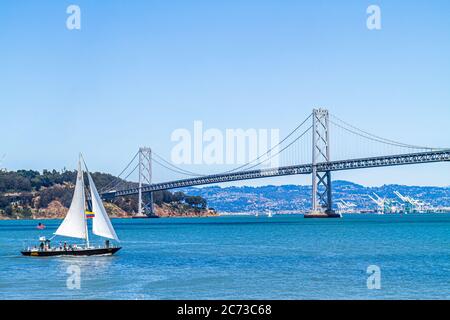 San Francisco California,The Embarcadero,Ferry Plaza,view,San Francisco Bay,Oakland Bay Bridge,Yerba Buena Island,sailboat,sailing,water,CA110717022 Stock Photo
