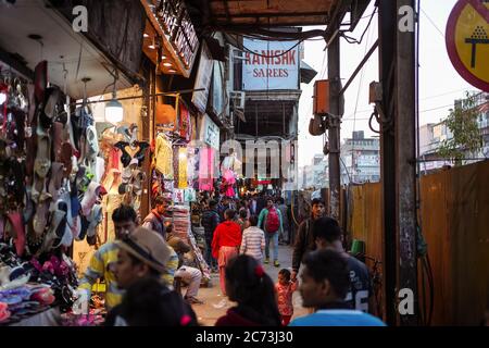 New Delhi / India - February 18, 2020: crowd walking in commercial covered street of Delhi Stock Photo