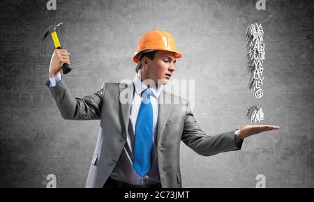 Businessman going to crash exclamation mark Stock Photo