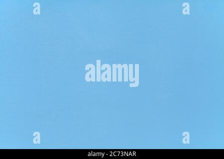 Metallic wall background, texture. Sky-blue smooth painted surface. The wall sketch, painted with blue water-based paint. The building wall Stock Photo