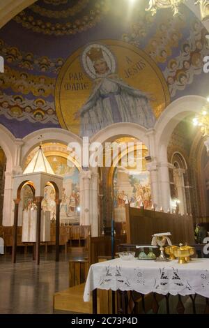 Apr 28. 2014 Lourdes France Through Mary to Jesus. Monumental mosaic murals adorn the interior of Rosary Basilica. Stock Photo