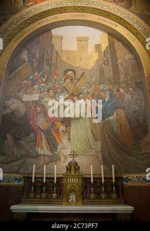 Apr 28. 2014 Lourdes France Jesus with the cross on his shoulder. Monumental mosaic murals adorn the interior of Rosary Basilica. Stock Photo