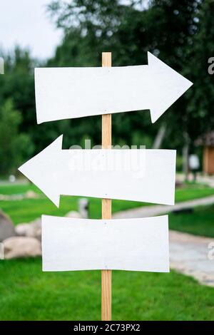arrow sign with pointers and a place for the signature on the column Stock Photo