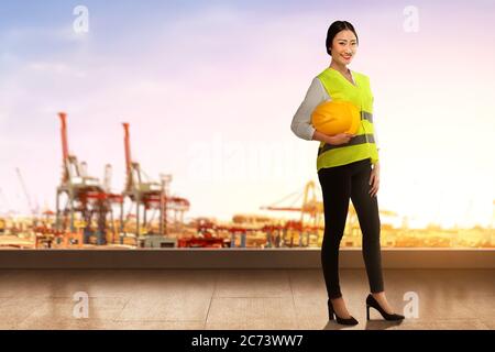 Asian construction worker holding a hardhat. Happy Labor Day Stock Photo