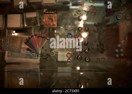 A display case of body piercing jewellery at a tattoo and body piercing parlour in Sydney, Australia. Stock Photo