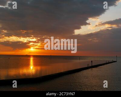 Sunset over the Walpole Bay Tidal Pool, Margate, Kent, UK Stock Photo