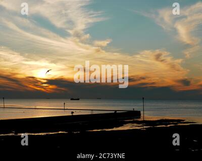 Sunset over the Walpole Bay Tidal Pool, Margate, Kent, UK Stock Photo