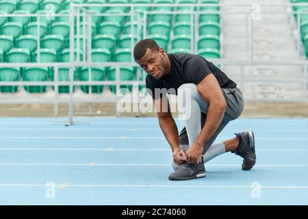 handsome african man preparing to run, full length photo. copy space.preparation for workout Stock Photo