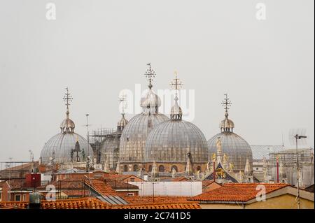 Europe, Italy, Veneto, Venice. City built on the Adriatic Sea lagoon. City of water canals instead of roads. Capital of the Serenissima Republic of Venice. UNESCO World Heritage Site. Domes of the Basilica of S. Marco Stock Photo