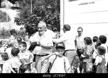 Bosnian Muslims receive aid from a British NGO who had travelled from the UK in convoy during the conflict in 1994 Stock Photo