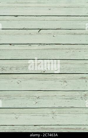 The texture of old scratched green wooden planks. Old painted wood wall texture. Stock Photo