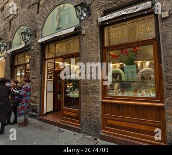 Florence, Italy - 04 November, 2017: Views of the Tourists enjoying in the Perseo bar in the Piazza della Signoria. Stock Photo