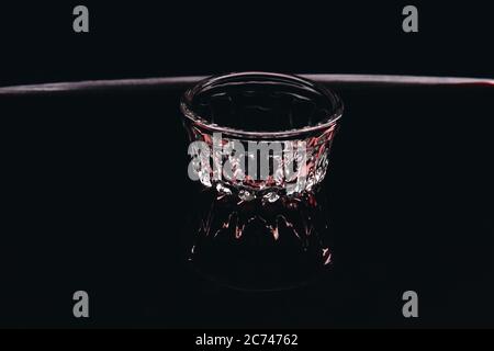 Small glass bowl on black background. Stock Photo