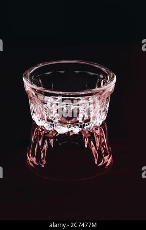 Empty elegant low glass on dark background. Stock Photo