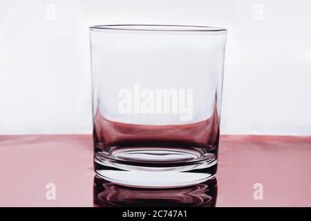 Empty small shot glass on white background. Stock Photo